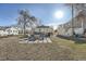 Backyard featuring an outdoor seating area with mature trees providing shade at 1135 Orion St, Golden, CO 80401