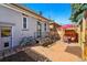 Charming backyard brick patio with table, chairs, and manicured yard at 315 E Bayaud Ave, Denver, CO 80209