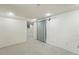 Spacious basement area offers neutral carpet and bright overhead lighting at 315 E Bayaud Ave, Denver, CO 80209