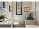 Modern bathroom featuring a vessel sink, stylish fixtures, and a tile shower at 315 E Bayaud Ave, Denver, CO 80209