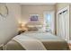 Cozy bedroom showcasing a comfortable queen-sized bed, lamps, and soft decor at 315 E Bayaud Ave, Denver, CO 80209