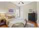 Comfortable bedroom with hardwood floors, neutral colors, and a bright window at 315 E Bayaud Ave, Denver, CO 80209
