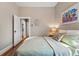 Relaxing bedroom featuring a queen-sized bed, neutral colors, and natural wood floors at 315 E Bayaud Ave, Denver, CO 80209