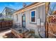 Gray painted home boasts back entrance, charming porch, and fenced yard at 315 E Bayaud Ave, Denver, CO 80209