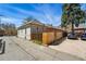 Street view showing gray house with fenced yard and driveway access at 315 E Bayaud Ave, Denver, CO 80209