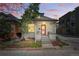 Charming home featuring a well-maintained front yard and inviting entry at sunset at 315 E Bayaud Ave, Denver, CO 80209