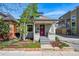 Charming home with a well-kept front yard, brick accents, and inviting entry way at 315 E Bayaud Ave, Denver, CO 80209