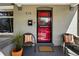 Inviting front porch with seating, showcasing the red security door at 315 E Bayaud Ave, Denver, CO 80209