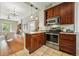 Open kitchen displaying stainless steel oven and granite countertops, seamlessly connecting to living spaces at 315 E Bayaud Ave, Denver, CO 80209
