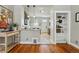 View of the kitchen featuring wood flooring, granite counters, and stainless steel appliances at 315 E Bayaud Ave, Denver, CO 80209