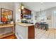 Bright eat-in kitchen featuring granite countertops, stainless steel appliances, and tile flooring at 315 E Bayaud Ave, Denver, CO 80209