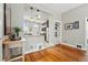 Open layout showcasing hardwood floors and seamlessly connecting the living and dining areas at 315 E Bayaud Ave, Denver, CO 80209