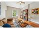 Bright living room showcasing hardwood floors, a fireplace, and a comfortable seating arrangement at 315 E Bayaud Ave, Denver, CO 80209