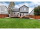 A view of the backyard, which features a spacious deck perfect for relaxing and entertaining at 18997 E Crestridge Cir, Aurora, CO 80015
