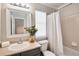 Well-lit bathroom featuring a vanity, mirror, and shower with curtain at 18997 E Crestridge Cir, Aurora, CO 80015