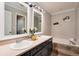 Bathroom featuring a double vanity, garden tub and decorative elements at 18997 E Crestridge Cir, Aurora, CO 80015