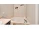 Bathroom featuring a garden tub and decorative shelving at 18997 E Crestridge Cir, Aurora, CO 80015