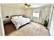 Spacious bedroom with ample natural light and a ceiling fan at 18997 E Crestridge Cir, Aurora, CO 80015