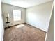 Bright bedroom with neutral walls, carpet, and a window providing natural light at 18997 E Crestridge Cir, Aurora, CO 80015
