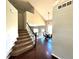 Inviting foyer featuring a staircase, hardwood floors, and chandelier at 18997 E Crestridge Cir, Aurora, CO 80015