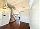 Bright foyer with hardwood floors, high ceilings, and a staircase leading to the upper level at 18997 E Crestridge Cir, Aurora, CO 80015