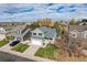 This is an eye-level view of a gray two-story home with a manicured front lawn at 18997 E Crestridge Cir, Aurora, CO 80015