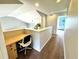 Hallway featuring a built in desk and shelving at end of hall at 18997 E Crestridge Cir, Aurora, CO 80015