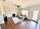 Comfortable living room with a fireplace, hardwood floors, and a walkout patio door at 18997 E Crestridge Cir, Aurora, CO 80015