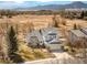 Scenic aerial view of the home with mountains in the background showcasing the property's serene and expansive setting at 4547 Tally Ho Trl, Boulder, CO 80301
