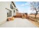 Expansive back patio with multiple levels and stairs with large backyard at 4547 Tally Ho Trl, Boulder, CO 80301