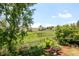 Discover serene backyard views, complemented by lush greenery, mature trees, and picturesque landscaping at 4547 Tally Ho Trl, Boulder, CO 80301