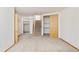 A finished basement area featuring a staircase and closet with shelves and wood floors at 4547 Tally Ho Trl, Boulder, CO 80301