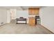 Finished basement with a kitchenette area featuring a sink, microwave, and mini-fridge at 4547 Tally Ho Trl, Boulder, CO 80301