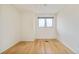 A bedroom featuring hardwood floors and a double hung window at 4547 Tally Ho Trl, Boulder, CO 80301