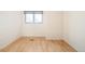 A bedroom with wood floors and a double hung window at 4547 Tally Ho Trl, Boulder, CO 80301