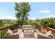 Cozy outdoor deck with comfortable seating and a scenic view of greenery at 4547 Tally Ho Trl, Boulder, CO 80301