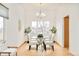 Elegant dining room with modern lighting, large windows, and stylish table for sophisticated meals at 4547 Tally Ho Trl, Boulder, CO 80301