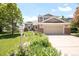 Inviting two-story home with a lush front yard and a convenient two-car garage at 4547 Tally Ho Trl, Boulder, CO 80301
