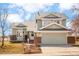 Charming two-story home with an attached garage and well-maintained front yard featuring an appealing roofline at 4547 Tally Ho Trl, Boulder, CO 80301