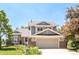 Charming two-story home with a well-manicured lawn and a two-car garage at 4547 Tally Ho Trl, Boulder, CO 80301