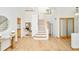 Open foyer showcasing hardwood floors, a staircase, and a glimpse of the living spaces at 4547 Tally Ho Trl, Boulder, CO 80301
