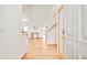 Bright foyer with hardwood floors and elegant staircase, creating a welcoming entrance at 4547 Tally Ho Trl, Boulder, CO 80301