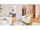 Cozy living room with hardwood floors, leading to an office space, and decorative furnishings at 4547 Tally Ho Trl, Boulder, CO 80301