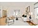 Bright living room with lots of natural light and neutral decor, offering a comfortable and stylish space at 4547 Tally Ho Trl, Boulder, CO 80301