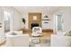 Bright living room featuring a brick fireplace, wood floors, and modern decor accents at 4547 Tally Ho Trl, Boulder, CO 80301