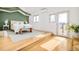Bright bedroom with hardwood floors, natural light, and a private balcony with views at 4547 Tally Ho Trl, Boulder, CO 80301