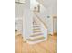 Bright staircase with light wood treads and white risers, complemented by wood floors at 4547 Tally Ho Trl, Boulder, CO 80301