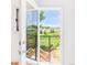 Scenic view from the balcony overlooking a lush green field and trees at 4547 Tally Ho Trl, Boulder, CO 80301
