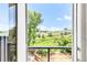 Breathtaking view from the balcony with a wooden deck overlooking lush greenery at 4547 Tally Ho Trl, Boulder, CO 80301