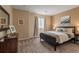 This bedroom offers a comfortable bed, neutral walls, and plenty of natural light from the window at 900 Wilshire Dr, Berthoud, CO 80513